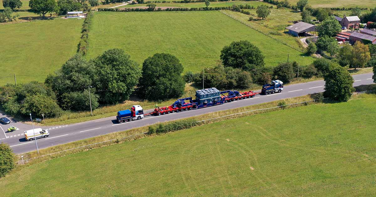 150 Tonne girder frame trailer transporting transformer along motorway section