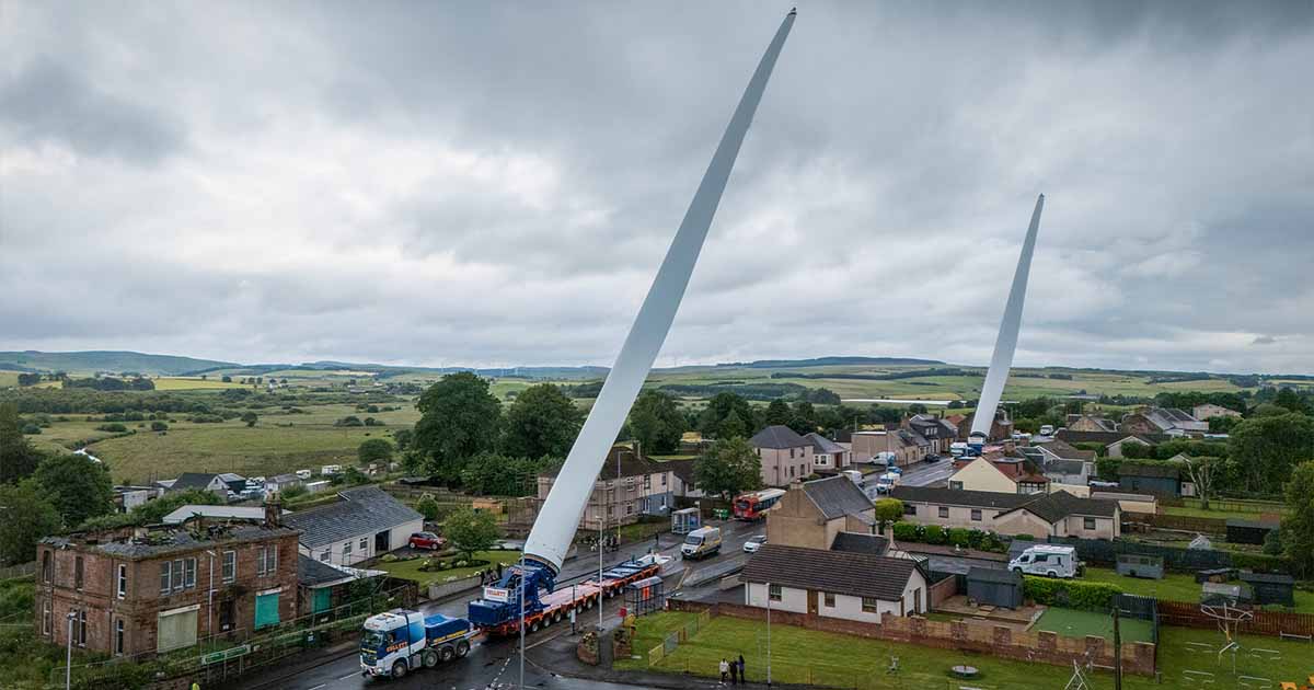 Dual blade lifter convoy transporting wind turbine blades at Sanquhar II Wind Farm