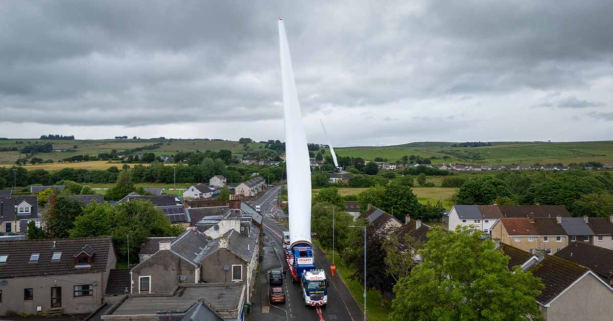 Specialist heavy transport convoy moving wind turbine components through a constrained access route